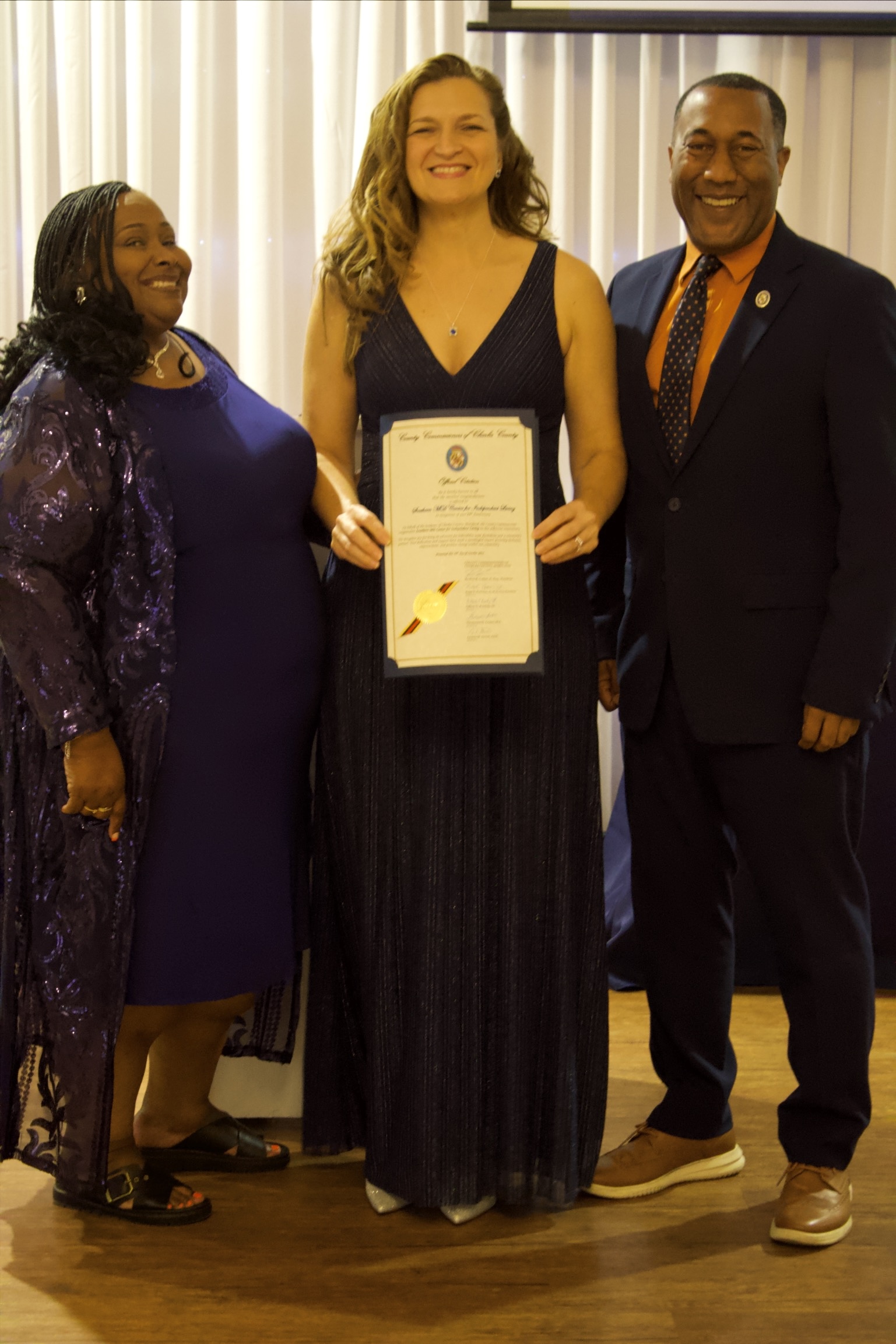 Gala Slideshow - Pam, Lidiya, and Commissioner Patterson accepting Proclamation