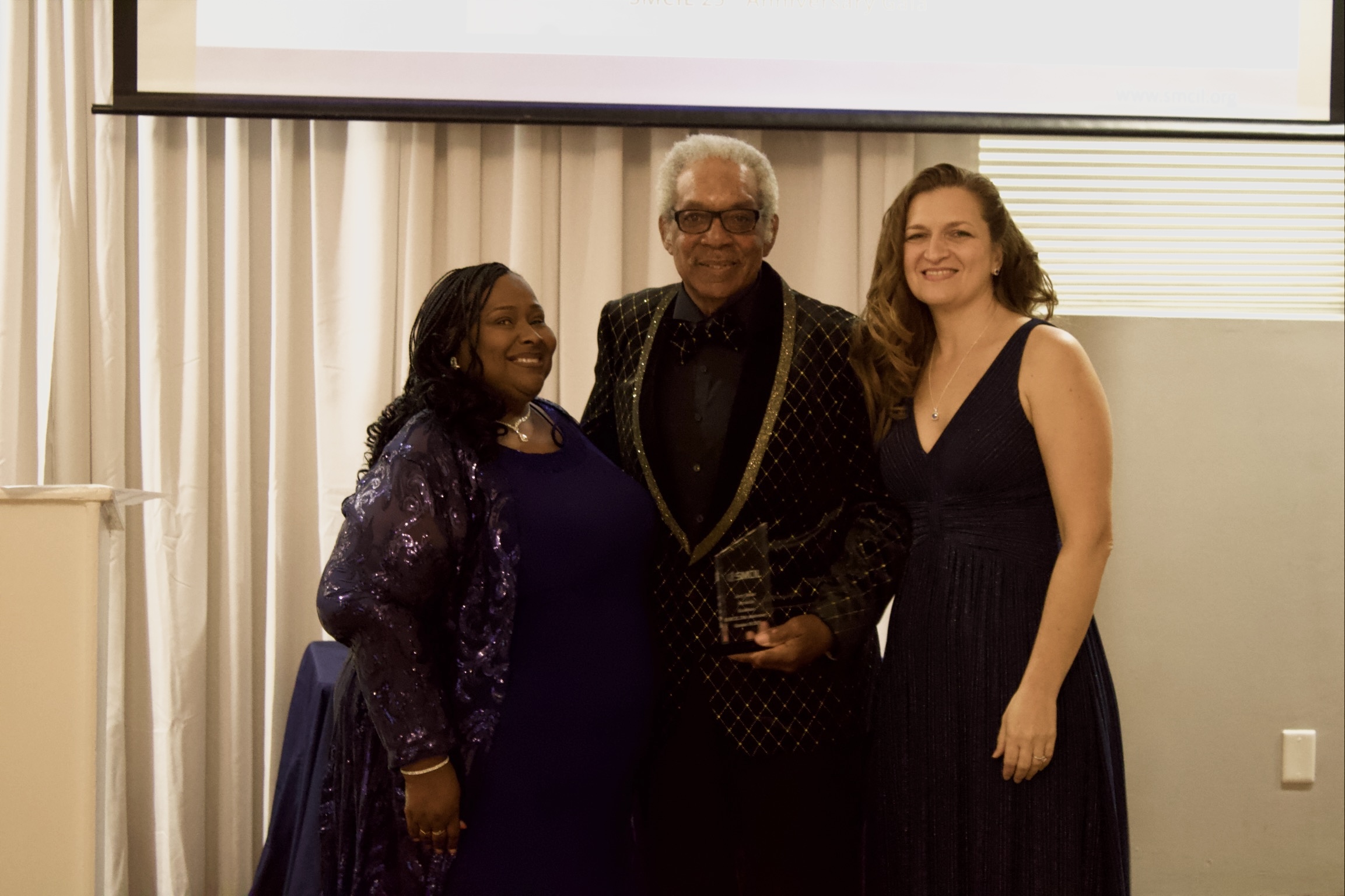 Gala Slideshow - Pam, Lidiya and Howard Dent with Jerry's award